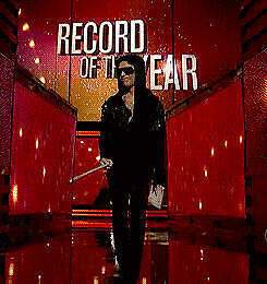 Prince presents "Record of the Year" at the 55th Grammys