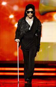 Prince walks onstage to present at the 55th Grammys in 2013