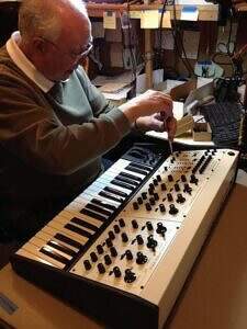 Tom Oberheim working on his classic model synthesizer