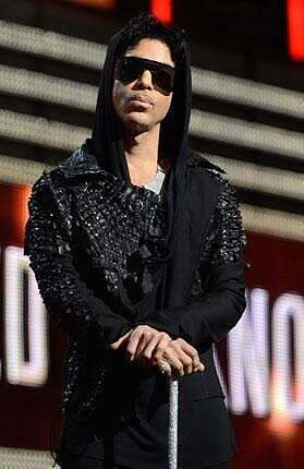 Prince presents "Record of the Year" at the 55th Grammys in 2013