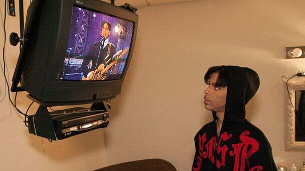Prince watching himself perform on video monitor