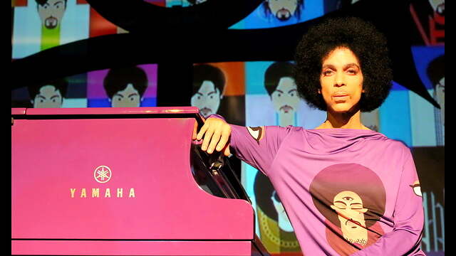 Prince leaning on piano 2015