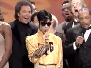 Prince with a tootsie pop at the 1995 AMAs