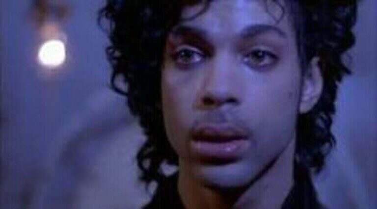 Prince staring ahead with tears in his eyes, Purple Rain 1984