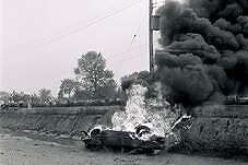 Bombed car on the side of the road