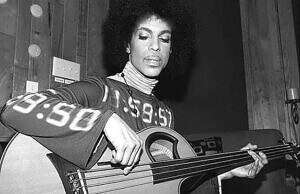 Prince on bass with "number" tunic shirt