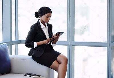 Black female lawyer reading on a tablet